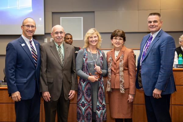 Photo of Veteran in Education Service Award Winner Adams-Campbell and others